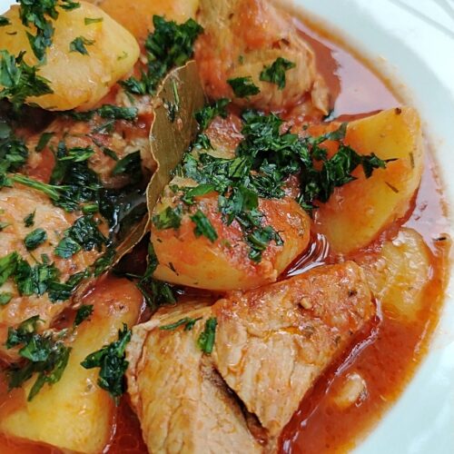pork potato stew on a platter