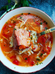 pork knuckle noodle soup in a bowl