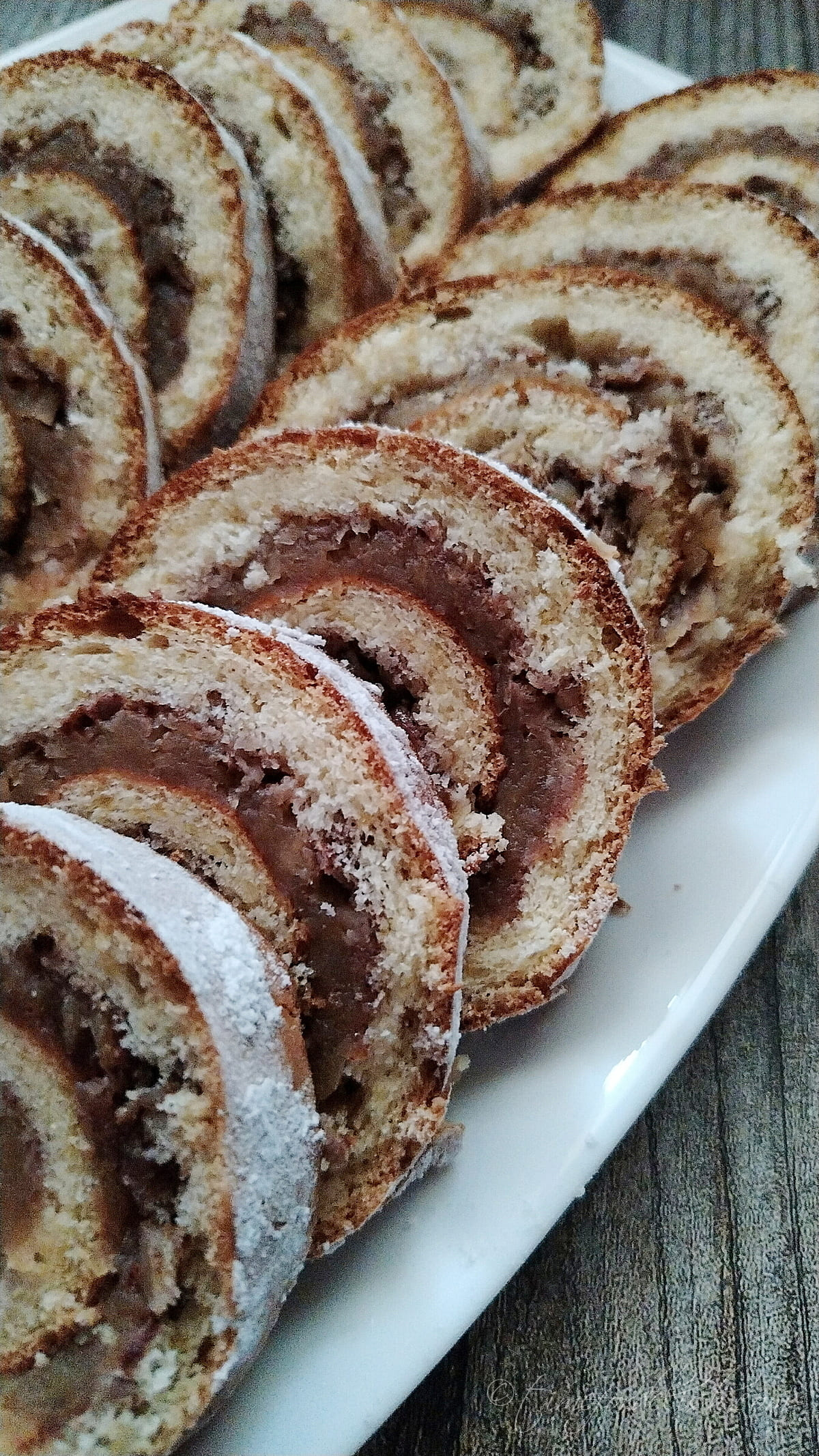 slices of apple cake roll on a platter