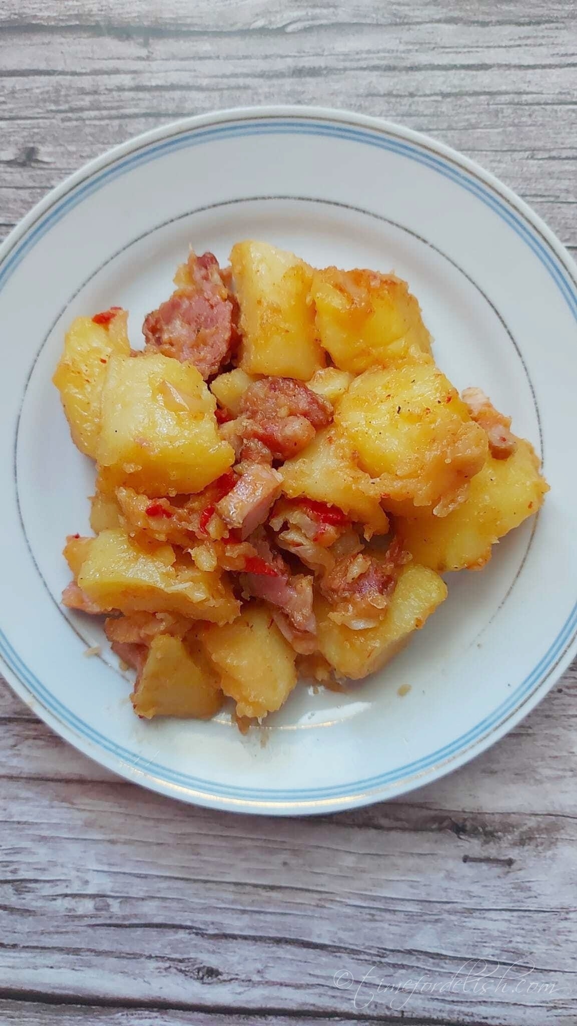 a portion of bacon potatoes bake on a plate