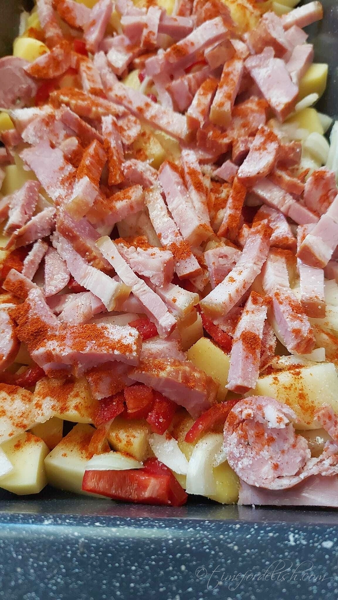 a casserole with bacon potatoes in the making