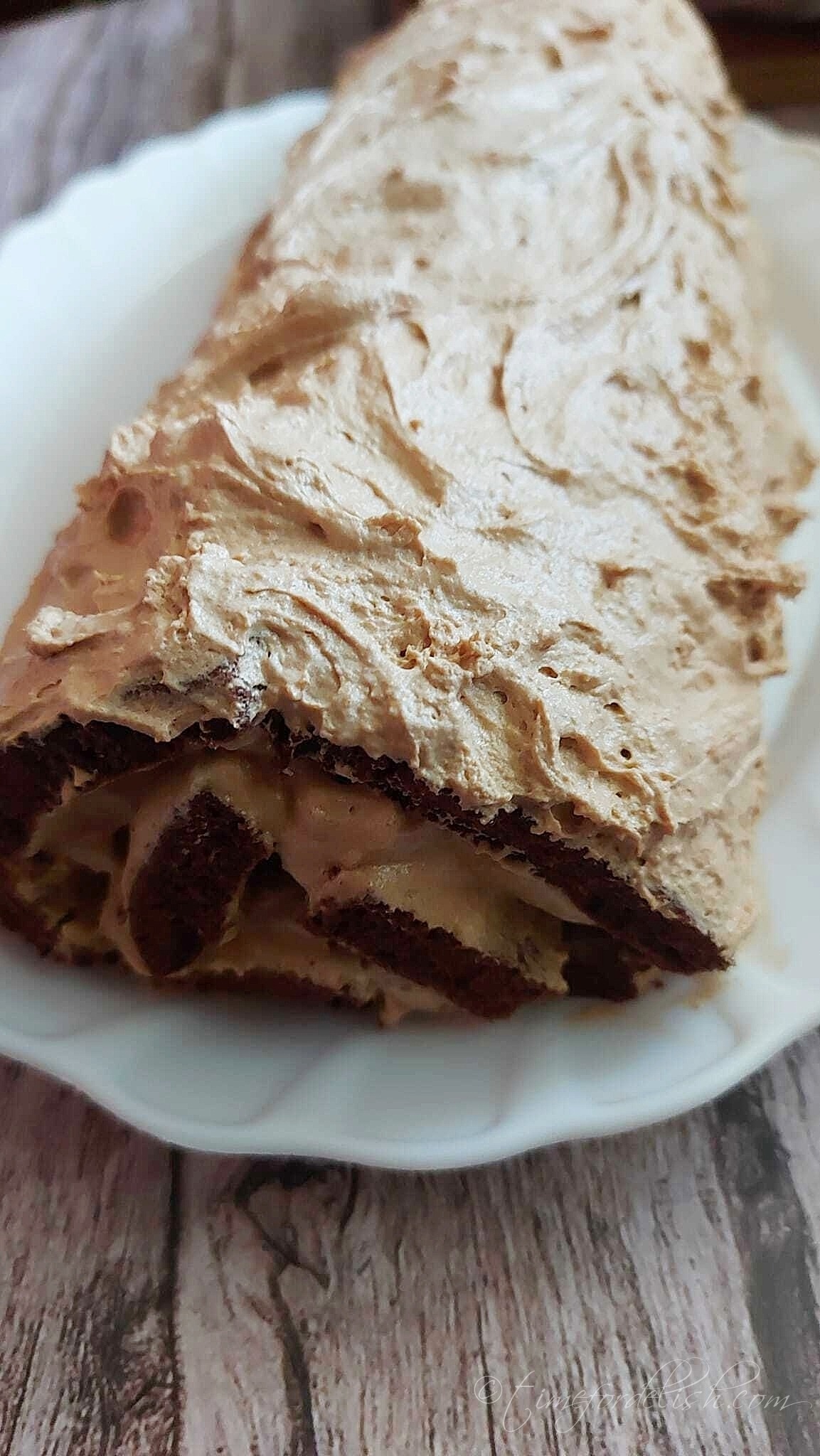 chocolate caramel swiss roll on a platter